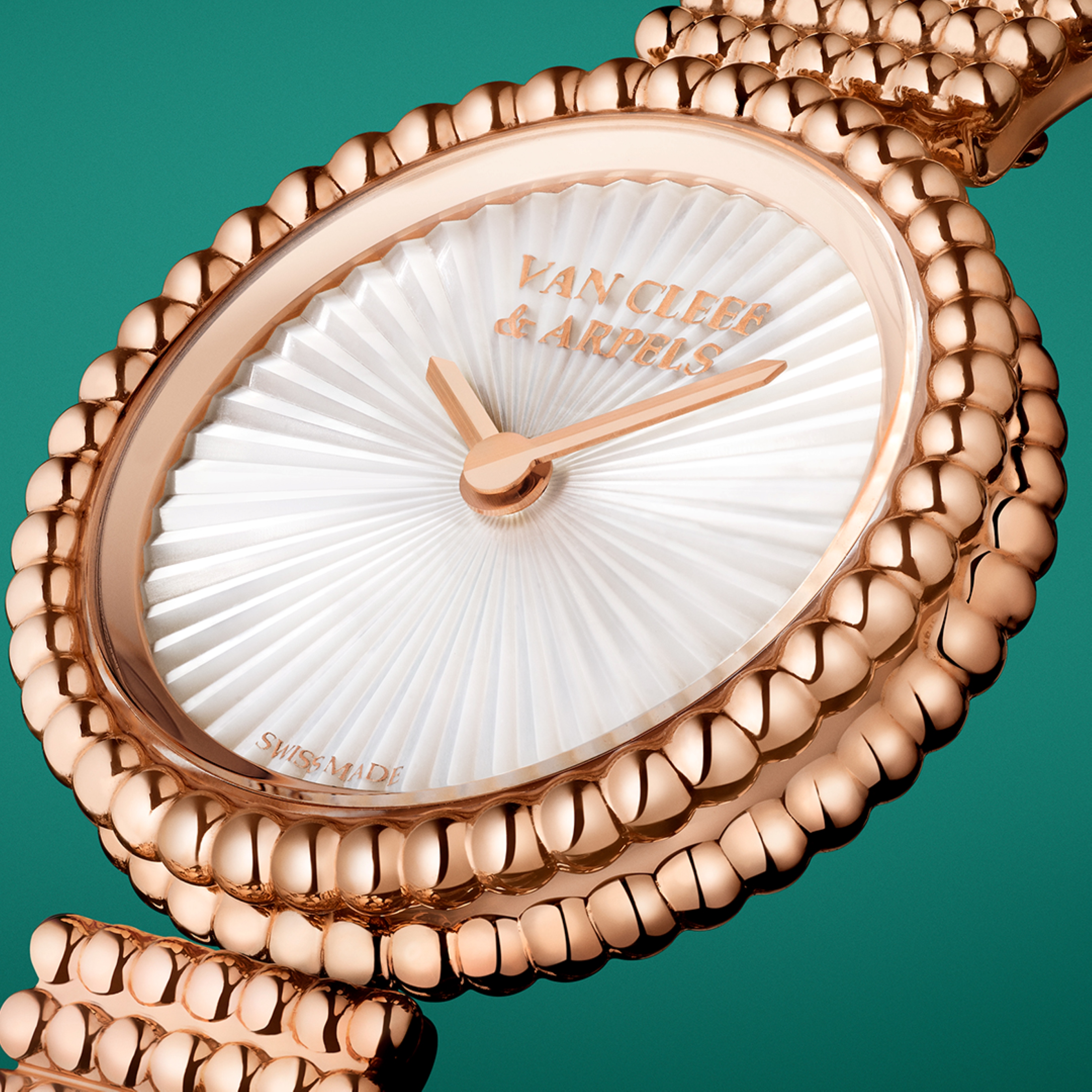 Perlée watch, 23 mm, 18K rose gold, guilloché white mother-of-pearl, Swiss quartz movement. Perlée® watches collection, Van Cleef & Arpels.