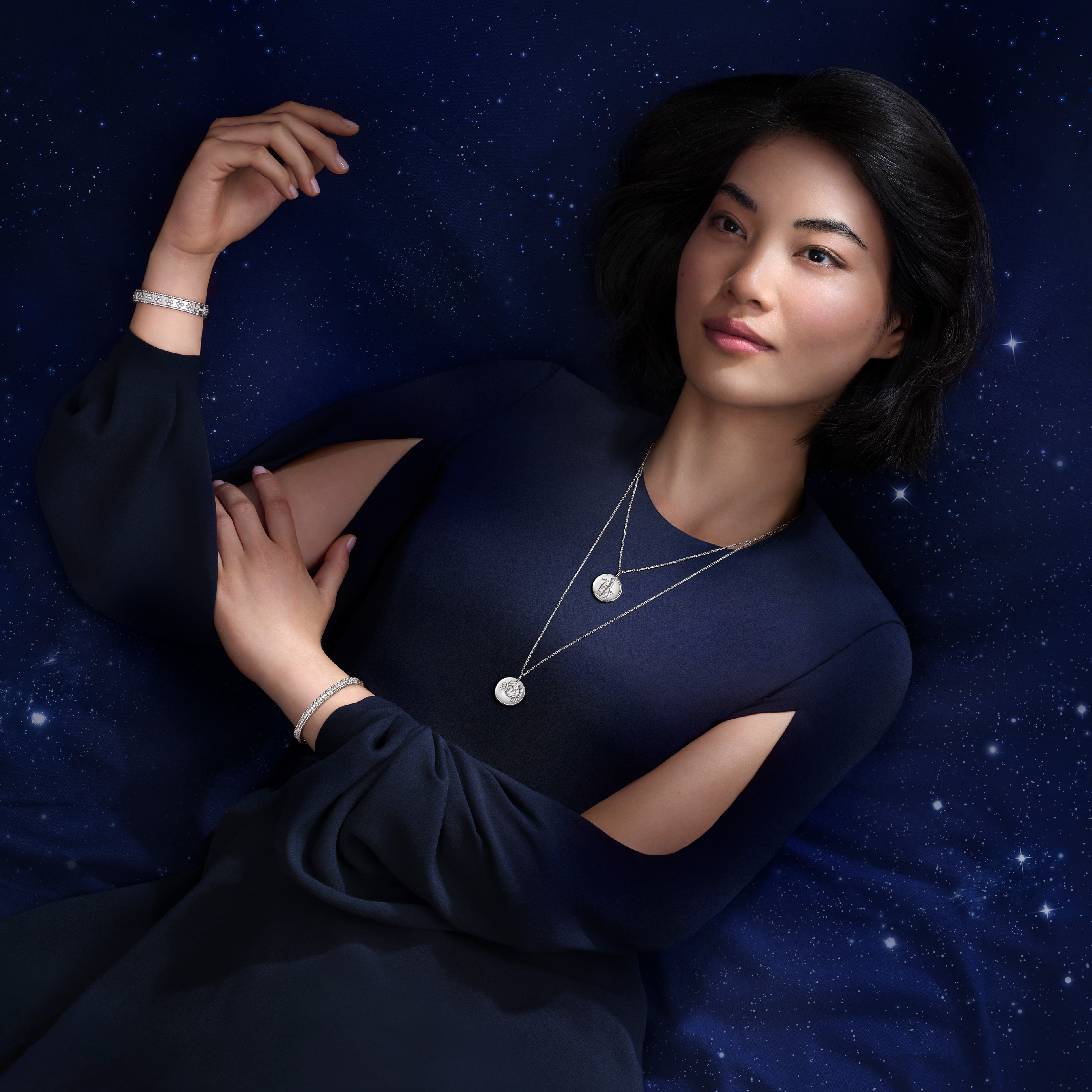 Zodiaque medals Cancri (Cancer) and Sagittarii (Sagittarius), Perlée diamonds bracelet, 1 row and Perlée clovers bracelet, rhodium plated 18K white gold. Zodiaque and Perlée collections, Van Cleef & Arpels.